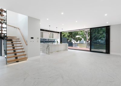 custom white interior with large sliding black windows.
