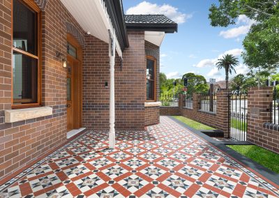 Charming brick federation exterior with patterned tiles.